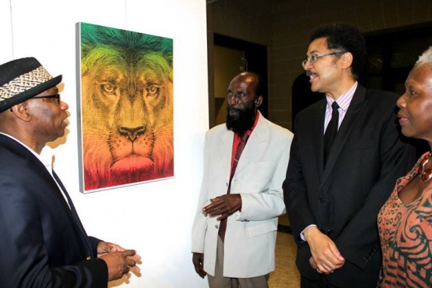 Michael Thompson of IRPC, Actor Carl Bradshaw, Ambassador Stephen Vasciannie Permanent Representative of Jamaica to the OAS and Professor Carolyn Cooper in front of the 30th winning poster (2013) of Manolis Angelakis (tind.gr) from Greece.
